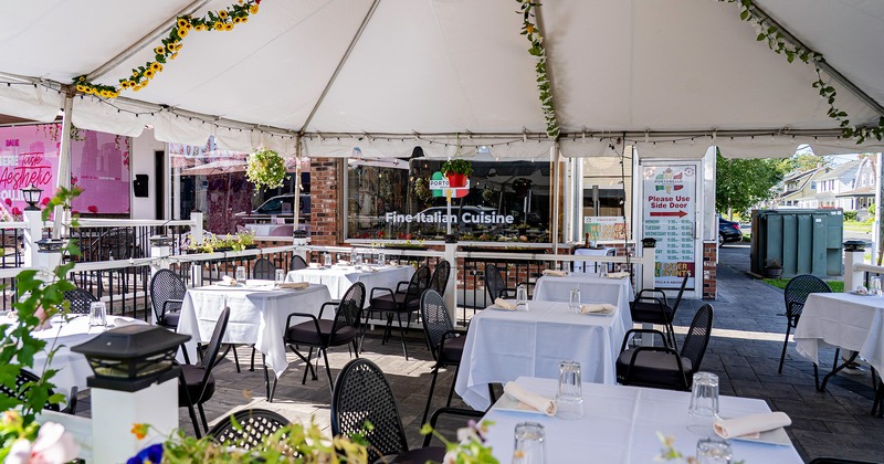 Cozy outdoor dining area with set tables ready for guests