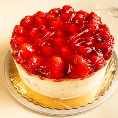 A whole strawberry cheesecake.