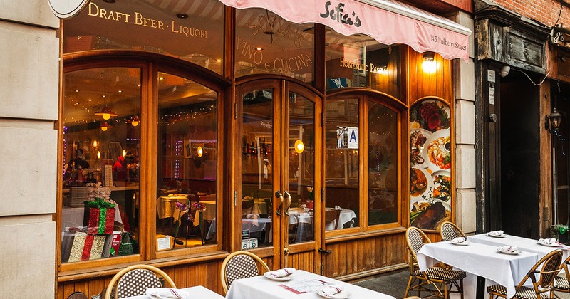 Exterior, tables set in front of the main entrance