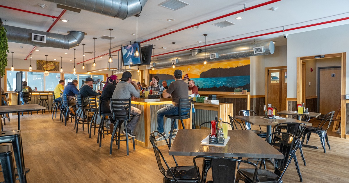 Interior dining area and bar area with guests