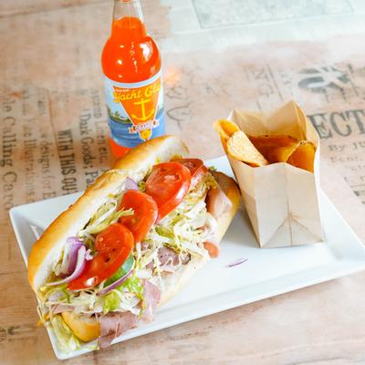 Americano sandwich with chips and soda on the side