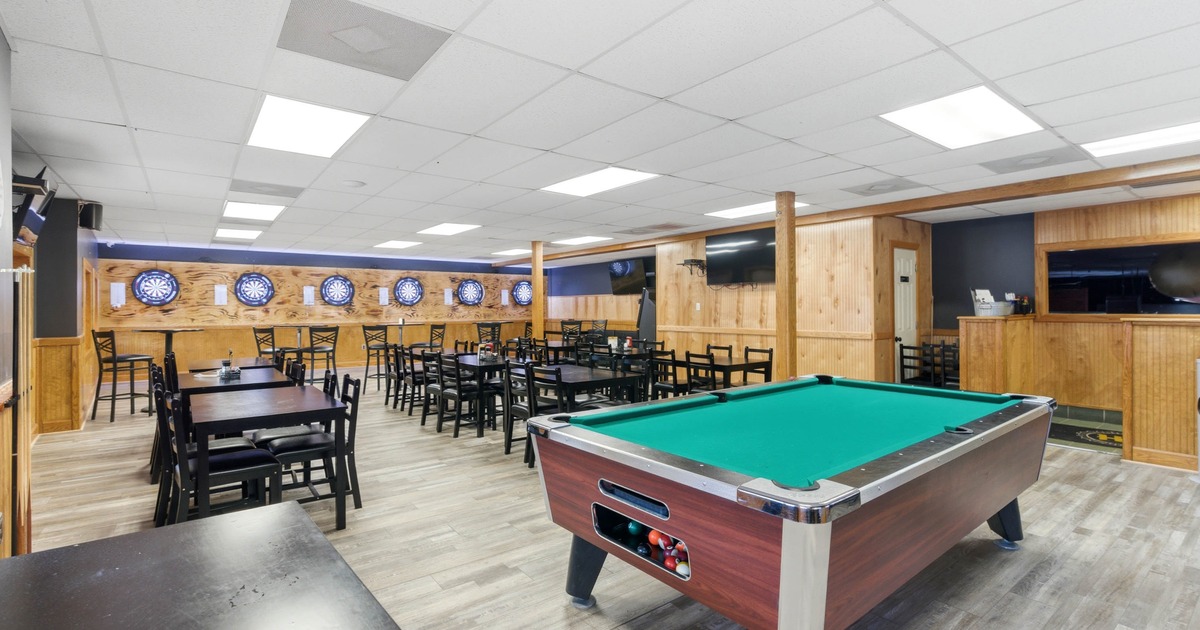 Interior space, lined up dining tables, chairs and upholstered seats