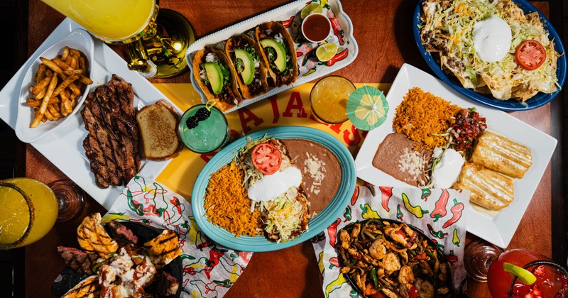 A large spread of various dishes and drinks from Casa Jalisco
