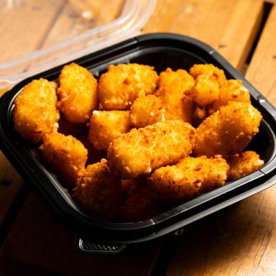Cheese curds, served, front view.