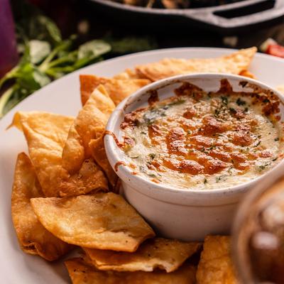 Spinach and artichoke dip, with tortilla chips.
