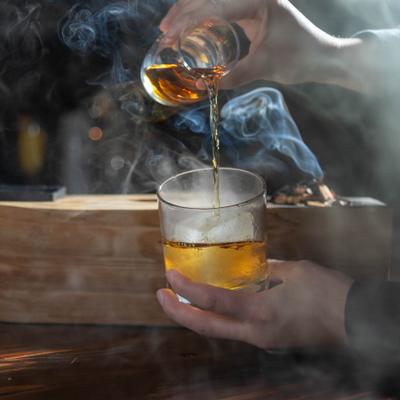 A bartender preparing Hickory Ember cocktail.