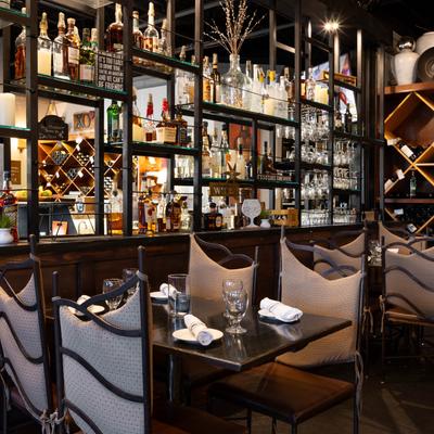 Shelves with numerous bottles.