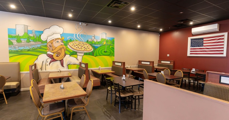 A cozy restaurant interior with wooden tables and chairs