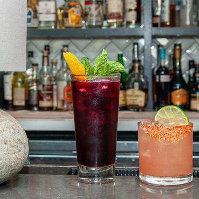 Two cocktails on the bar counter