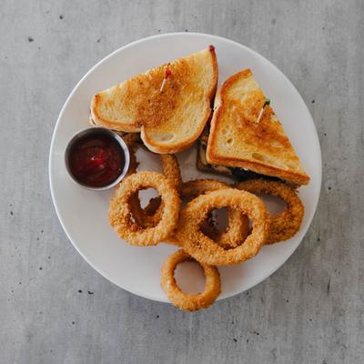 Chicken caprese with onion rings.