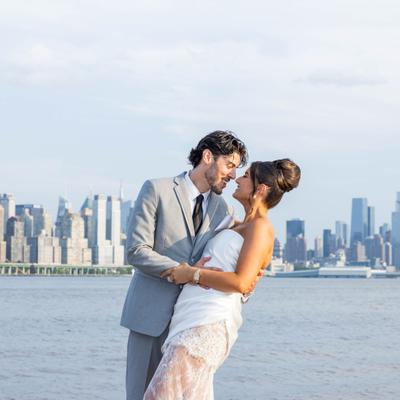 Newlywed couple embracing.