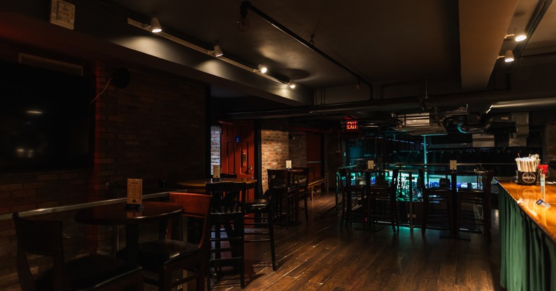 Interior, bar aream tables and bar stools, wide view