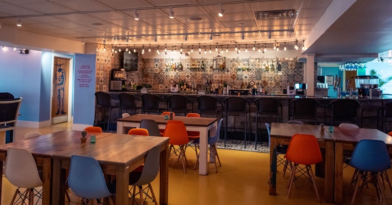 Interior,  dining tables and seating, the bar area in the back