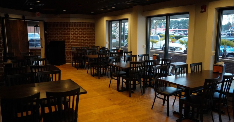 Interior, tables and chairs near windows