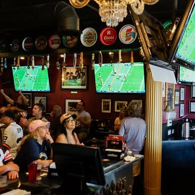 Interior, tv ans people watching the game