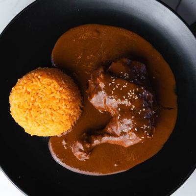 Mole served in black plate.