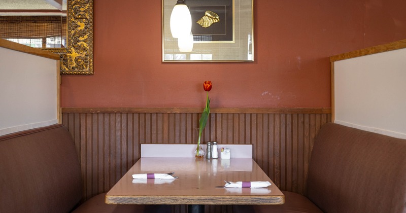 Restaurant booth with brown seats and table