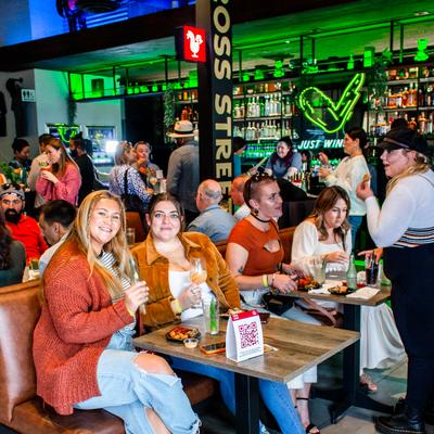 Friends enjoying food at our Del Mar location small