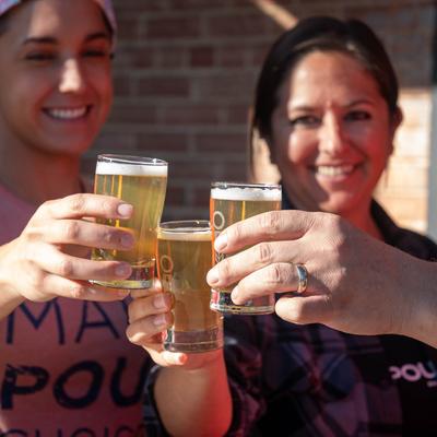 Customers toasting with beers.