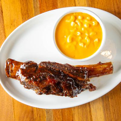 Twisted beef rib served with mac n cheese on the side.