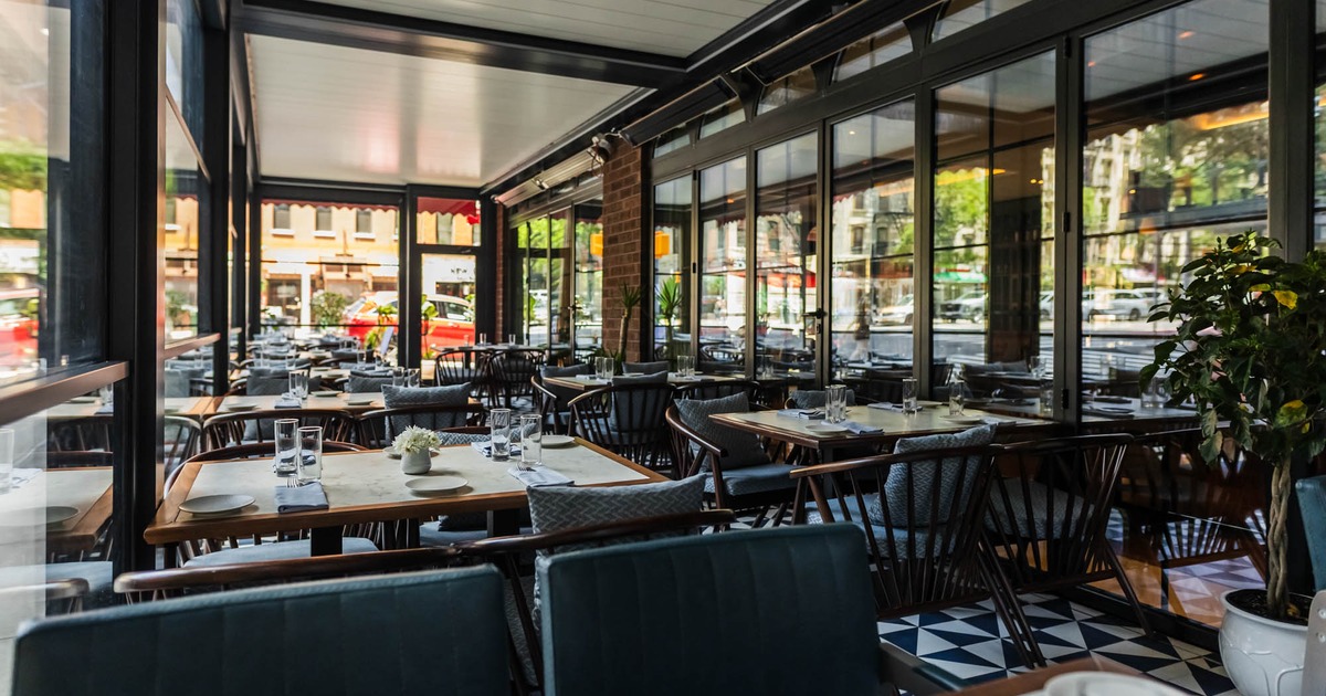 Covered patio with tables and chairs