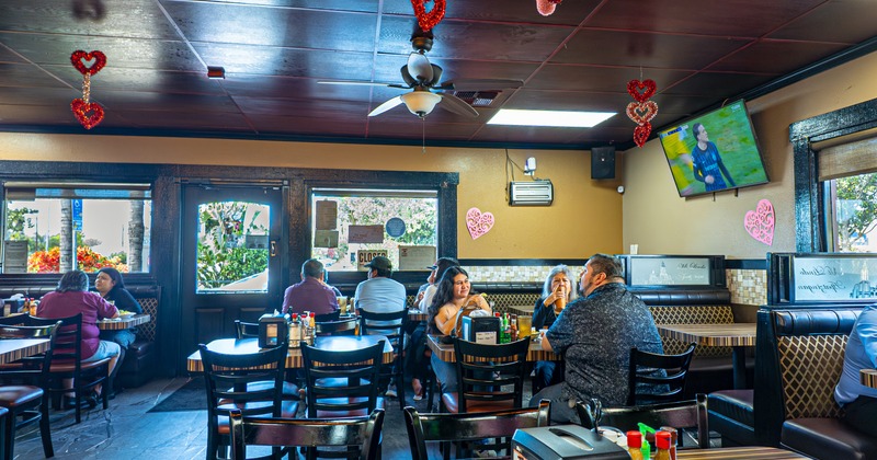 Interior, dining space with booths, tables and chairs