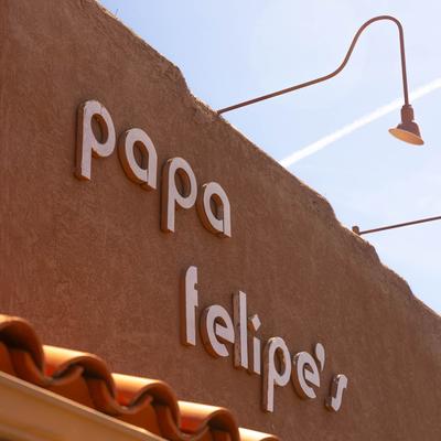 The restaurant's sign on the side of the building.