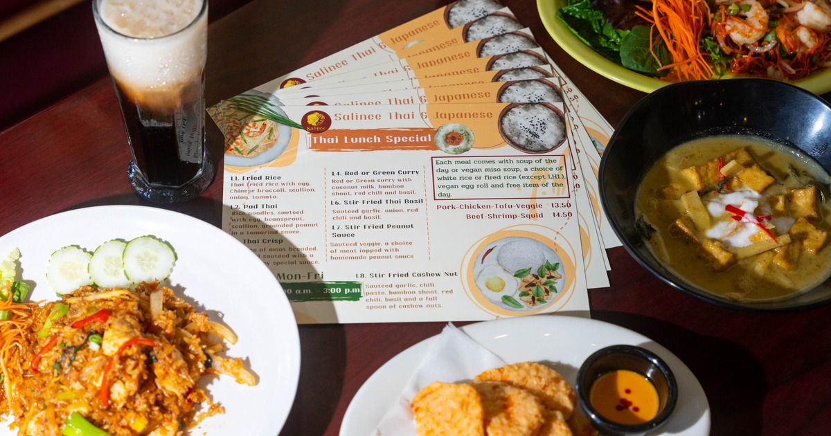 Lunch spread featuring fried rice, curry soup, appetizers, iced tea, and a Thai lunch special menus