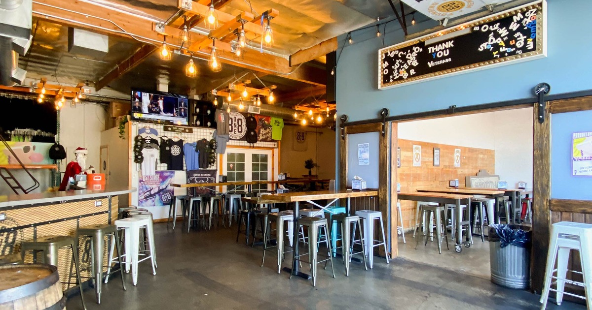 Interior featuring industrial vibe with concrete floors and a mix of high and low seating