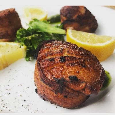 Meat wrapped in seared bacon.