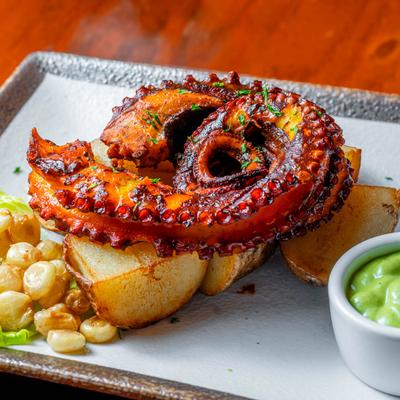 Pulpo a la Parrilla dish, grilled marinated octopus dish.