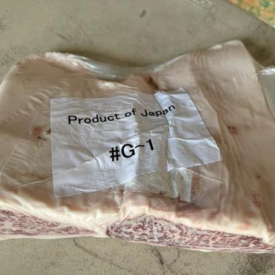 A package of meat featuring a label that reads Product of Japan, indicating its origin.