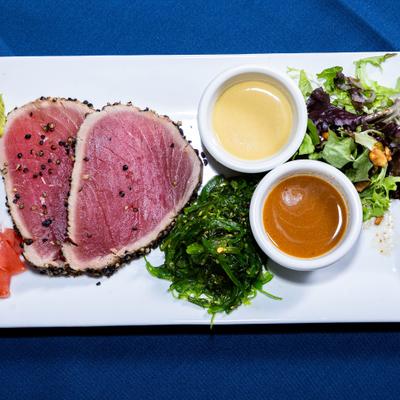 Peppercorn Crusted Tuna served with seaweed salad, mixed green salad and dressing.