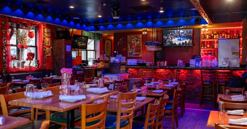 Spacious and romantic decorated restaurant interior with set dining tables