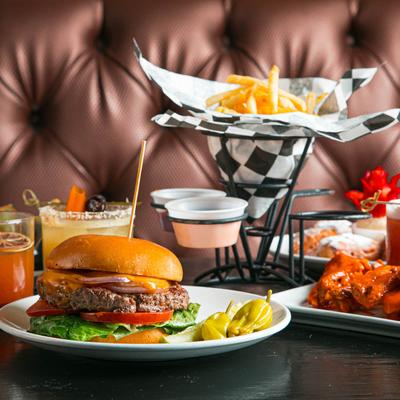 Assorted menu dishes and drinks  on a dining table.