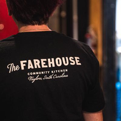 Staff's back with the restaurant's T-shirt print