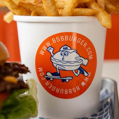 Fries in a 858 Burger logo cup.