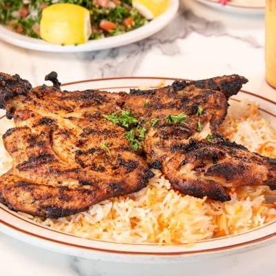 Grilled butterflied chicken served over saffron rice.