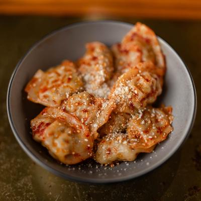 Served chili chicken dumplings.