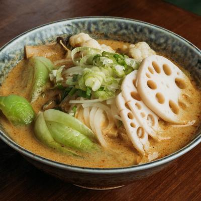 Curry Soup with spicy coconut curry broth, bok choy, and lotus.
