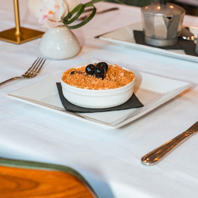 Homemade almond and vanilla semifreddo topped with amaretti crumbs and cherries.