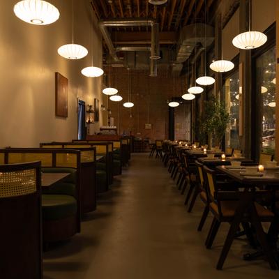 Cozy dining area with pendant lights.