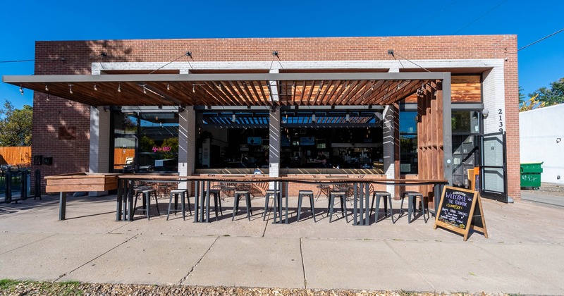 Exterior, sunny terrace, bar tables and chairs