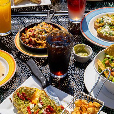 Different types of food on the tables, juices on the side