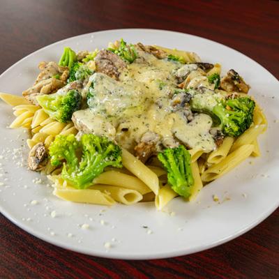 Penne pasta with chicken, broccoli, and Alfredo sauce.