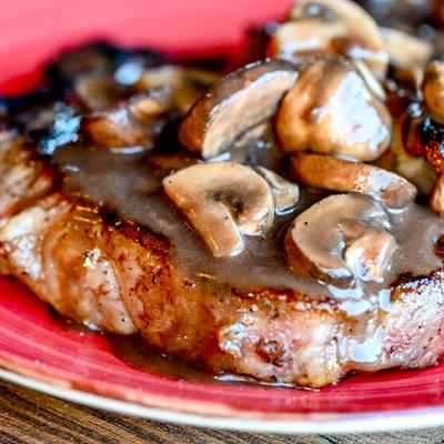 Grilled NY Steak With Red Wine Mushrooms.