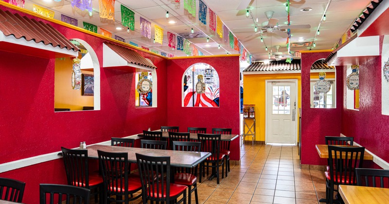 Interior, dining area, tables for six. four and two people, entrance, tile flooring