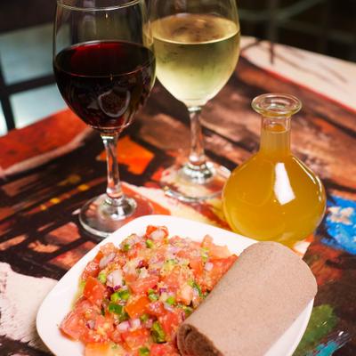 Appetizer Sampler served on the table with wine.