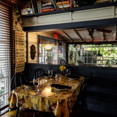 The interior, a table set for dining.