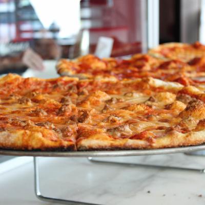 Pizza with cheese and sausage.